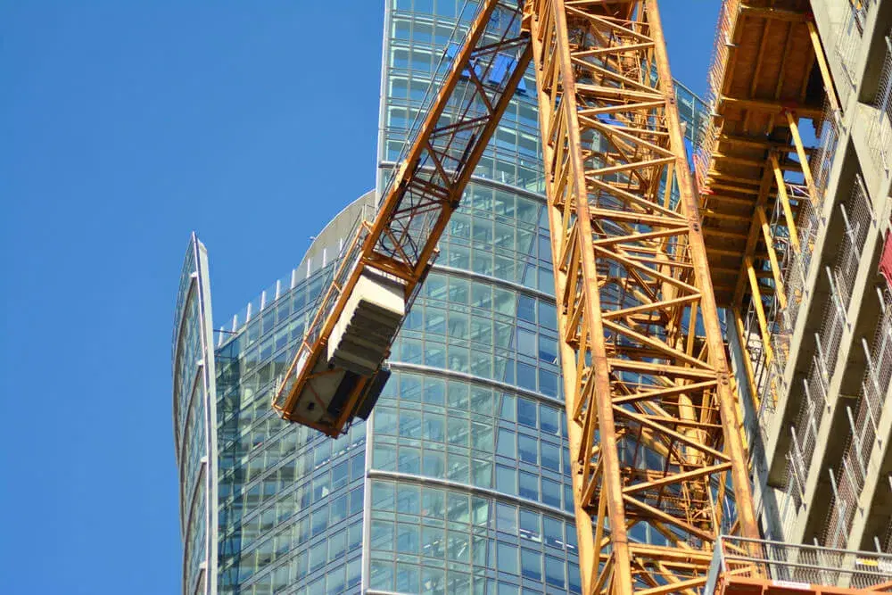 Construction site with crane and modern building